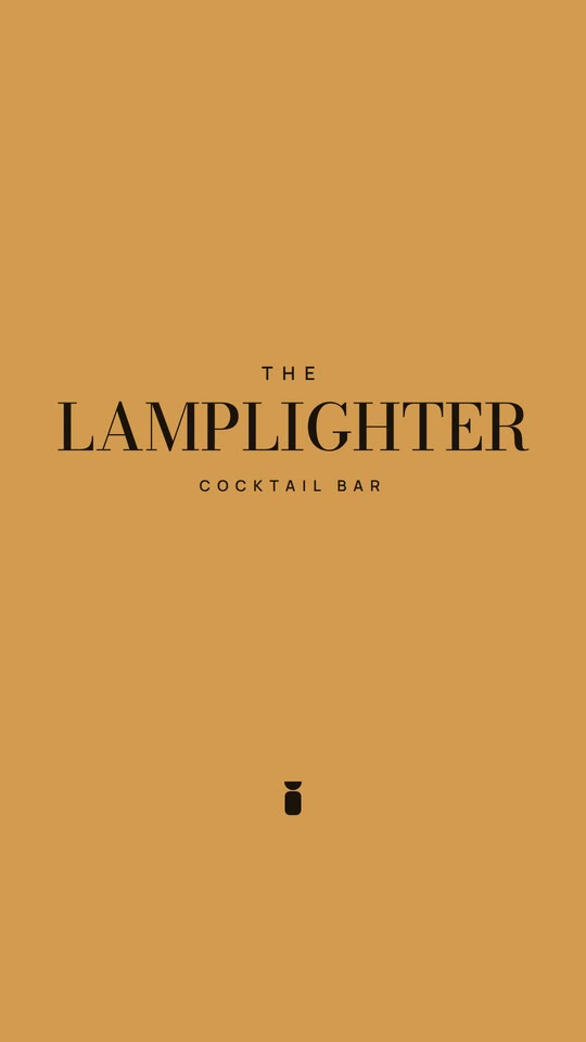 The final frame: the beam floods amber and reveals The Lamplighter